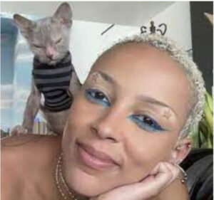 In June 2023, Doja Cat got a new cat named Froderick “Frodo” Frankenstein, or just Frodo for short. Frodo, seen here in a cute striped sweater, is from the Lykoi breed.