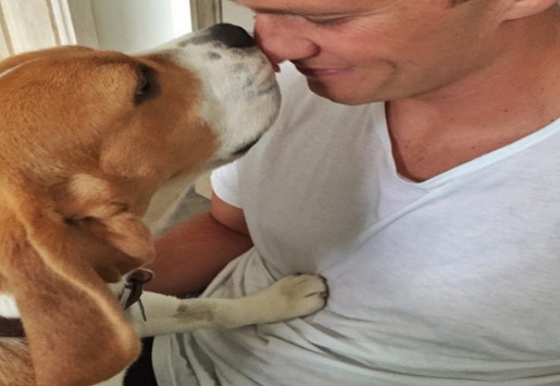An image of Tom Brady and his Dog