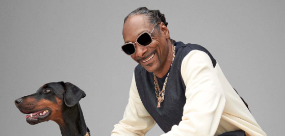 An image of Snoop Dogg and his dog