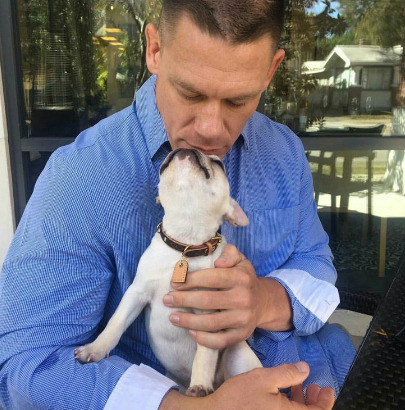 An image of John Cena and Dog: