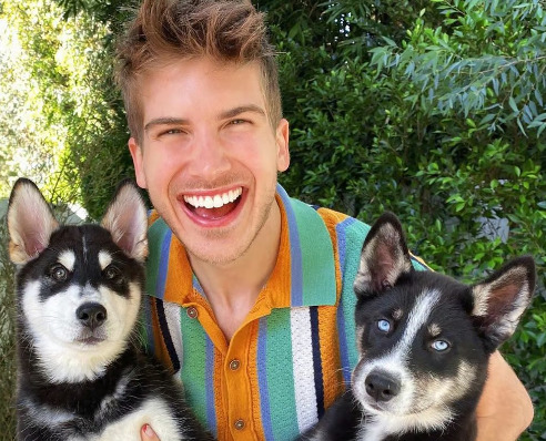 An image of Joey Graceffa and his Dogs: