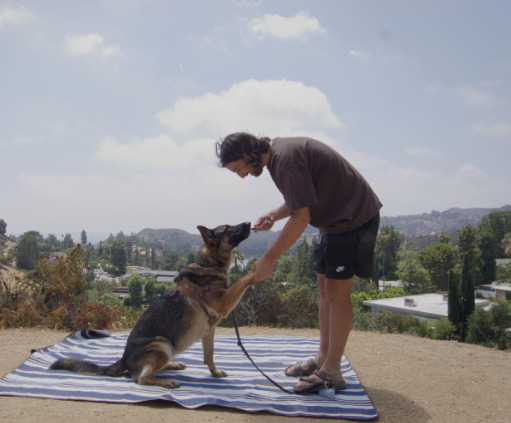An image of Noah Kahan and his Dog
