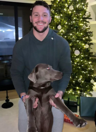 In image of Josh Allen with his Dog
