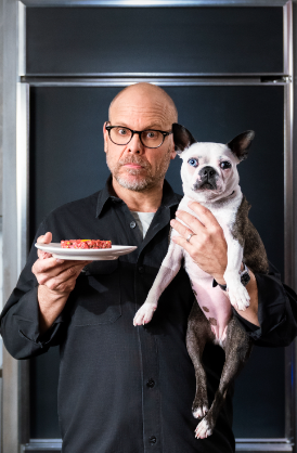 An image of Alton Brown with his Dog