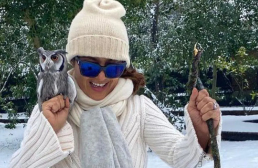 An image of Salma Hayek  and her Pet owl