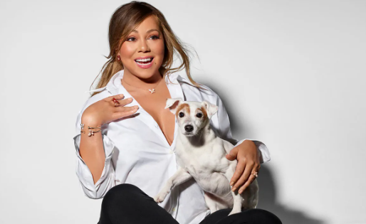 An image of Mariah Carey with her Dog