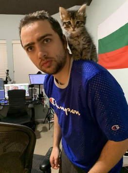 An image of Mizkif with his cat
