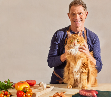An image of Bobby'Flay with Cat